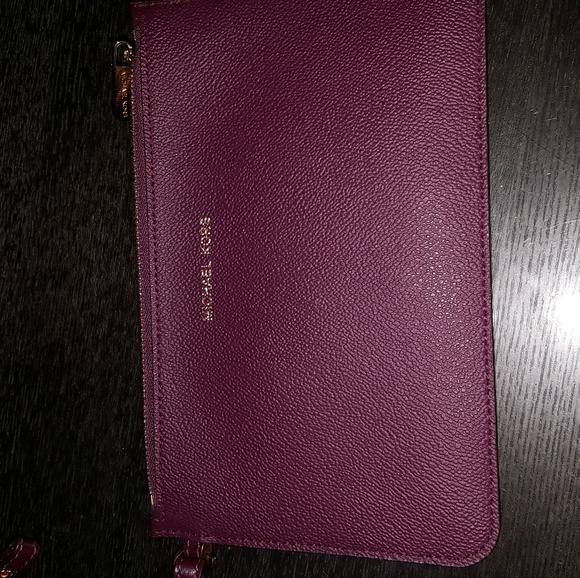 Michael Kors plum color clutch. - Picture 3 of 3