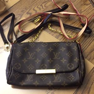 Louis Vuitton bag.  Not real boy looks great