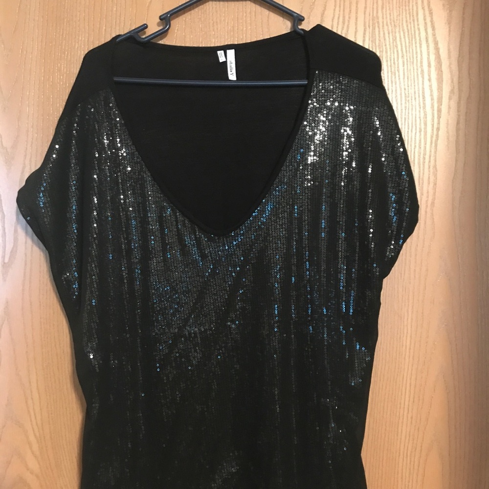 Black sequin front with black chiffon overlay.