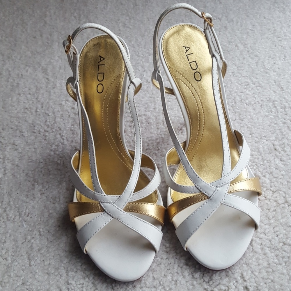 Leather soles. White and gold heels.  Worn once.
