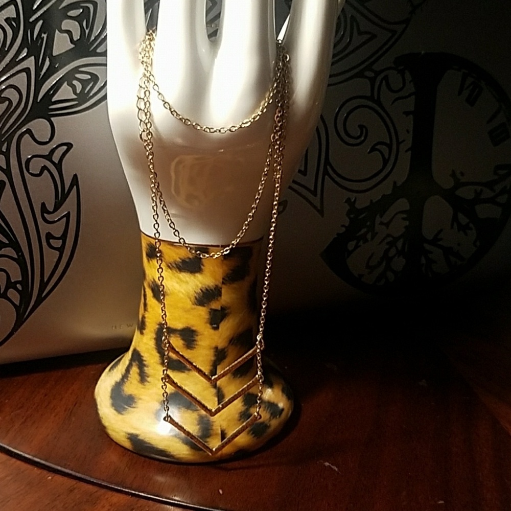 Long golden colored necklace