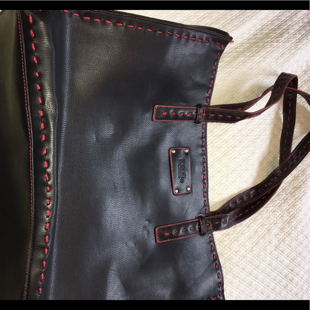 EUC black leather bag with red stitching accents