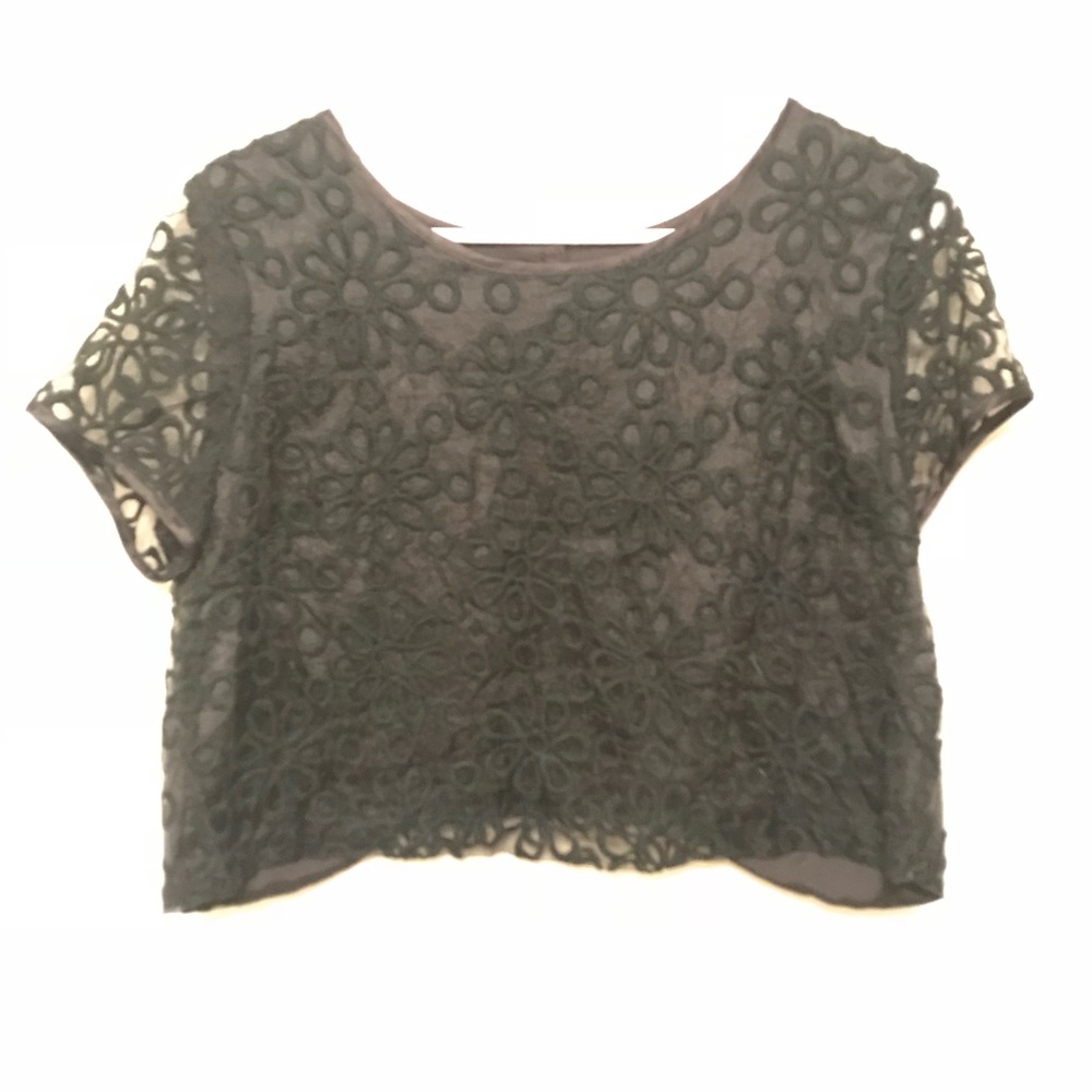 Black crop top with textured flowers.