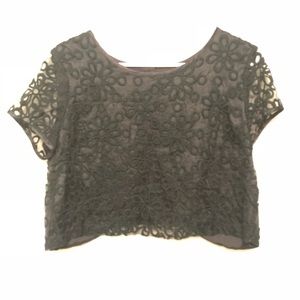 Black crop top with textured flowers.