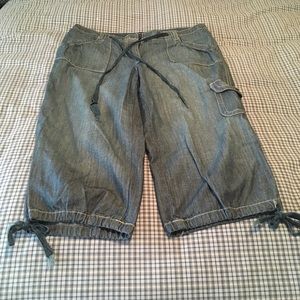 Denim capris with cargo pocket & ties at bottom.