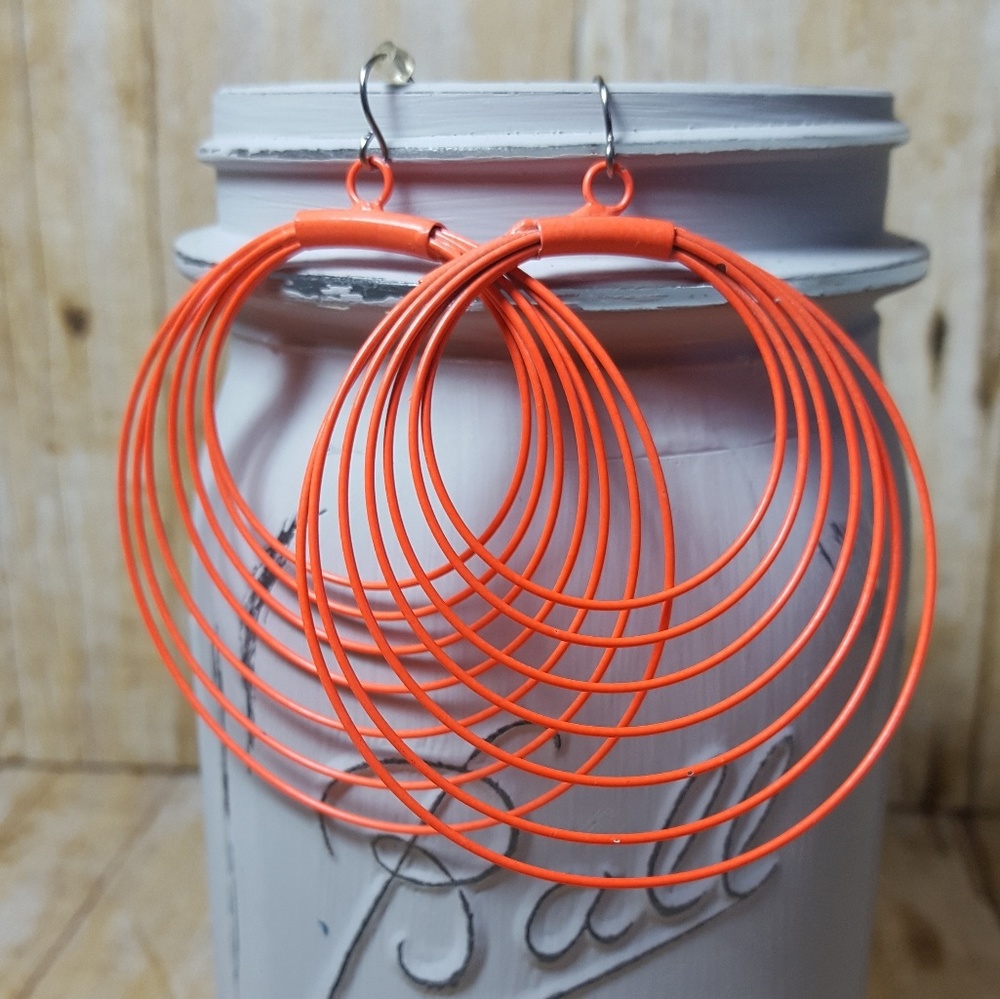 NWOT. Orange hoop earrings.