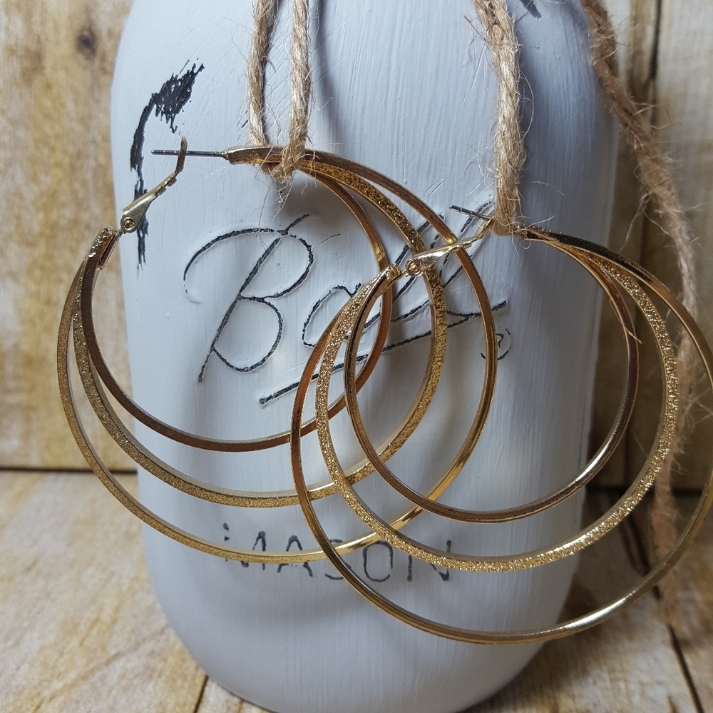 Gold tone. Multi hoop earrings.