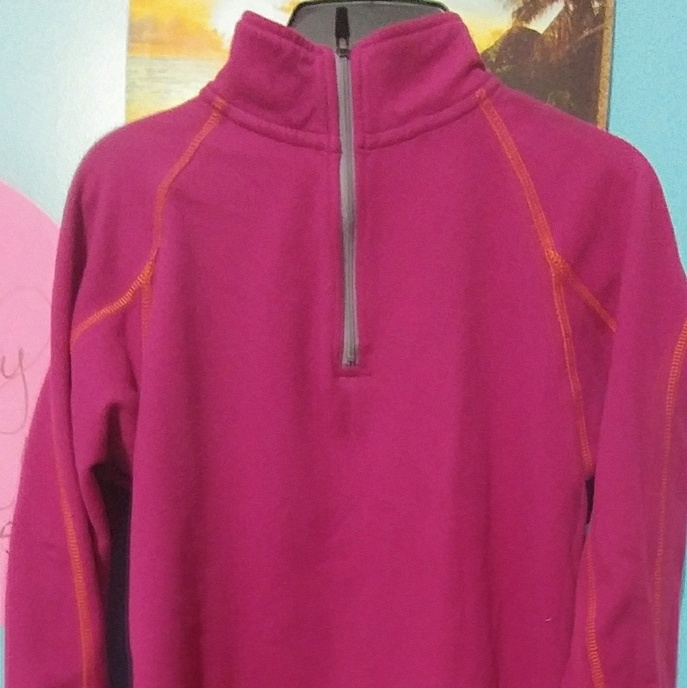 A pink colored sweatshirt from cableas