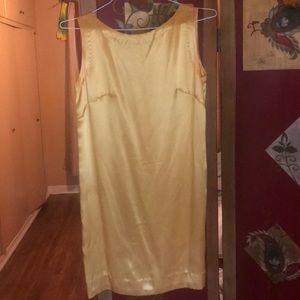 Woman’s gold dress