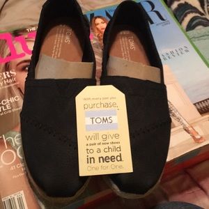 New in box Black Suede Toms