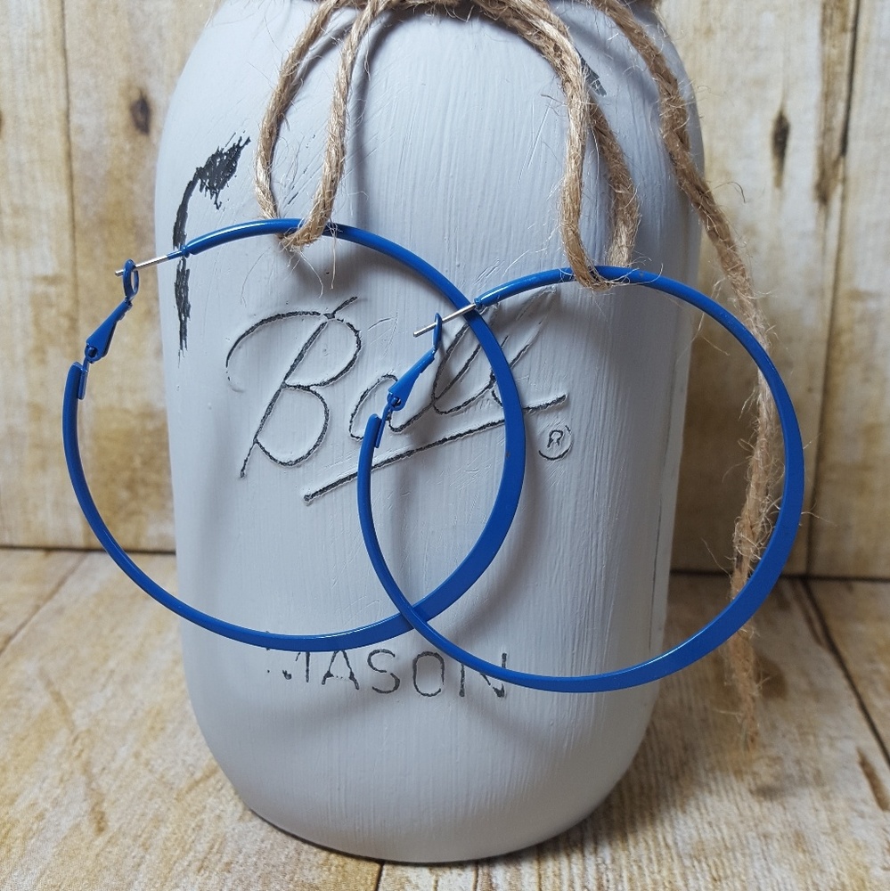 NWOT. Blue hoop earrings.