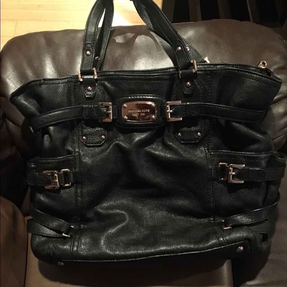 Michael Kors medium sized black leather handbag.