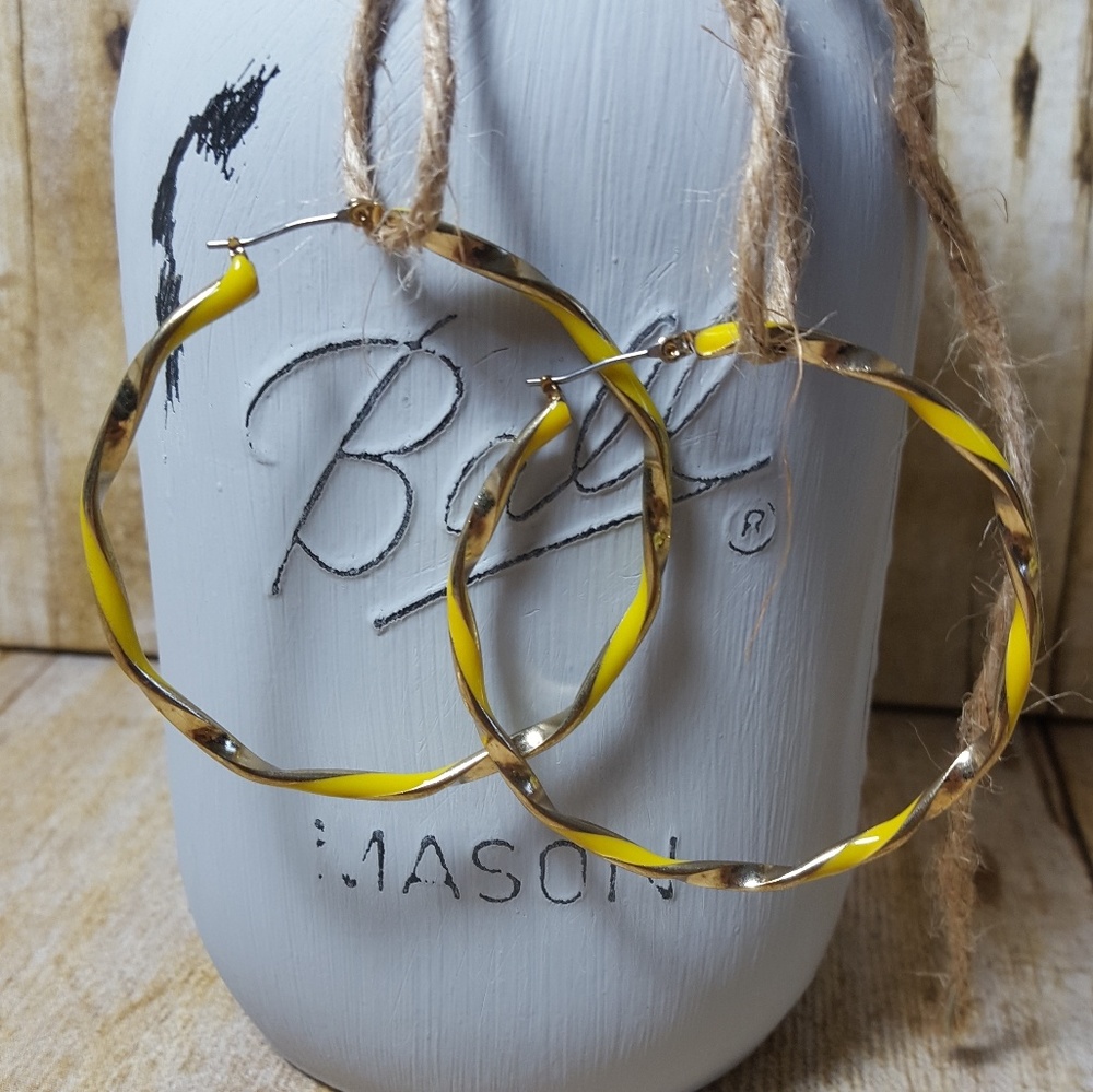 NWOT. Gold tone and yellow detailed hoops.