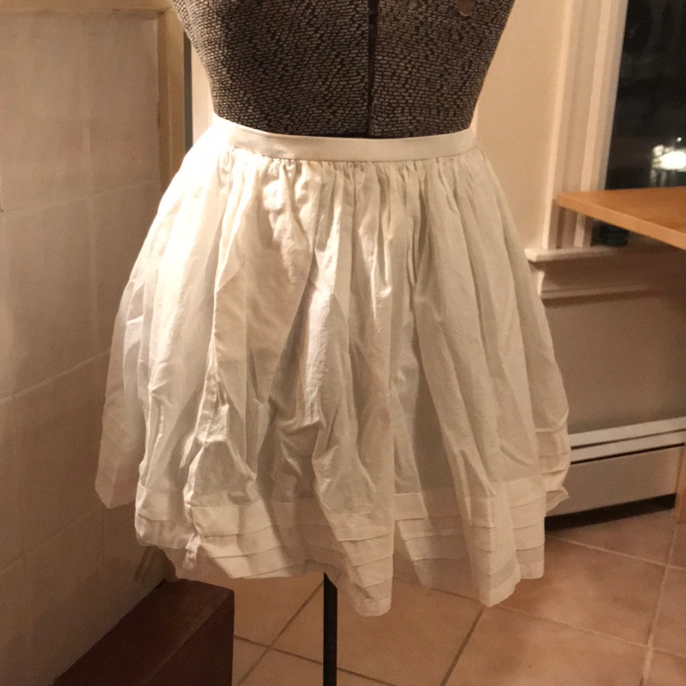 High waisted tiered white ruffle skirt.