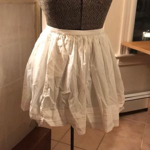 High waisted tiered white ruffle skirt.