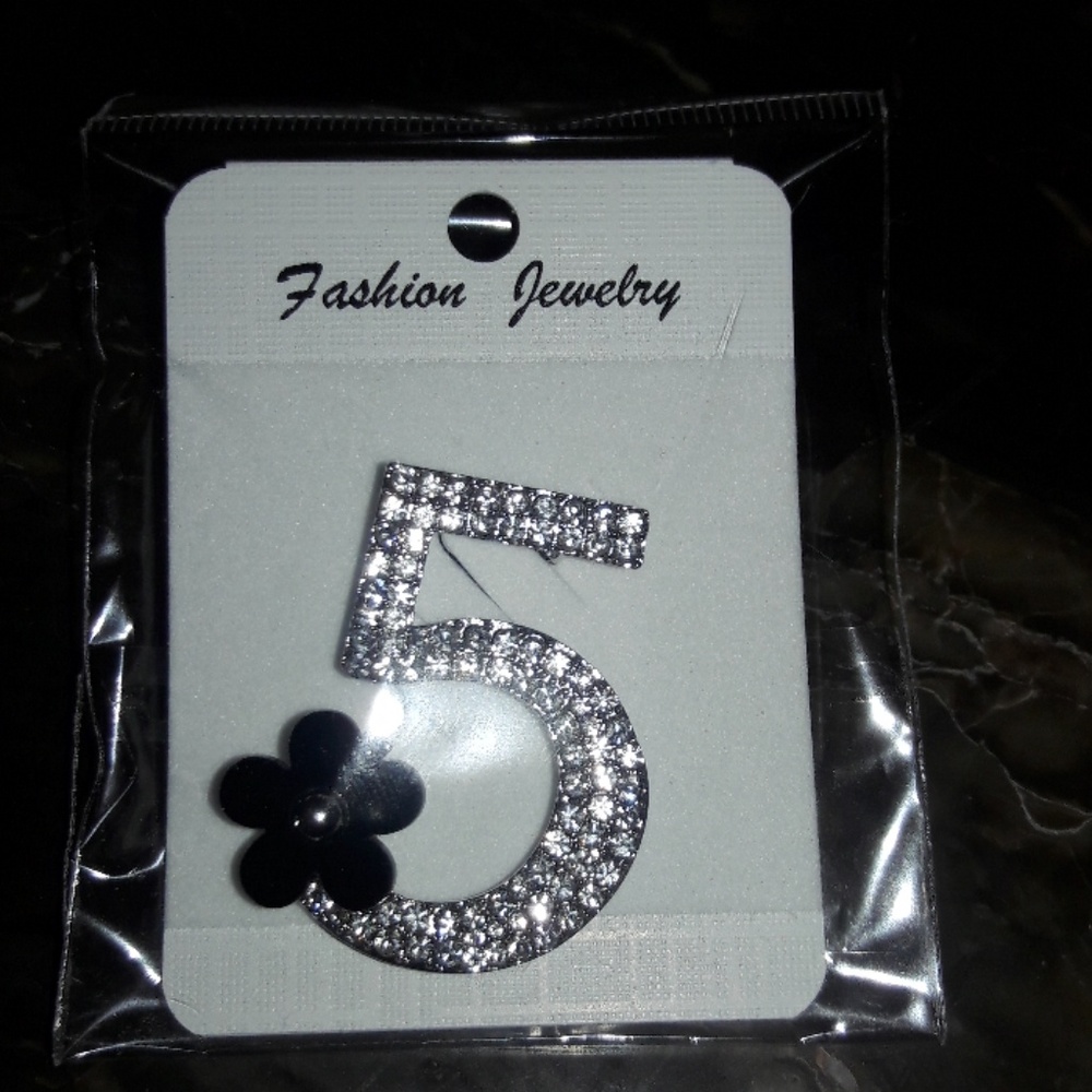 No. 5  broch with a black bow