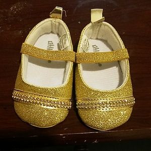 Gold baby shoes