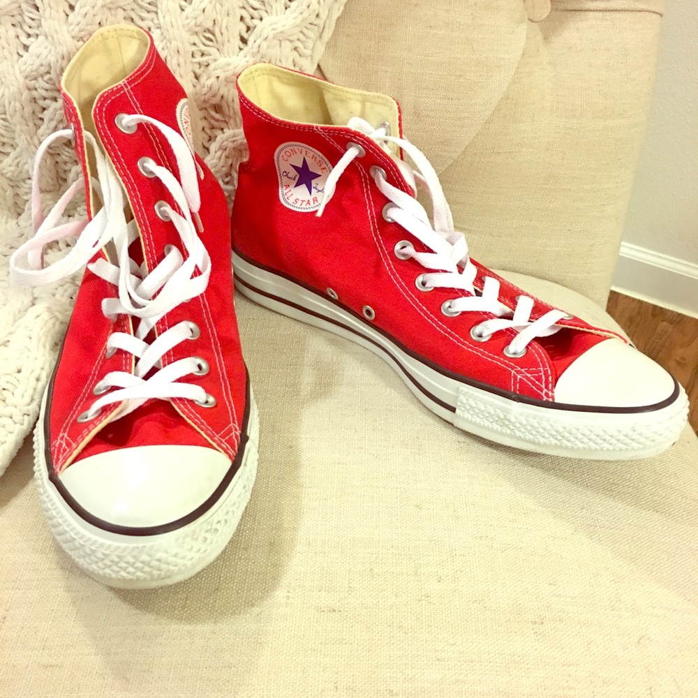 High top red Converse Chuck Taylor shoes