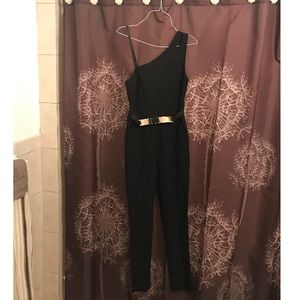 Material girl black jumpsuit wit gold accent belt