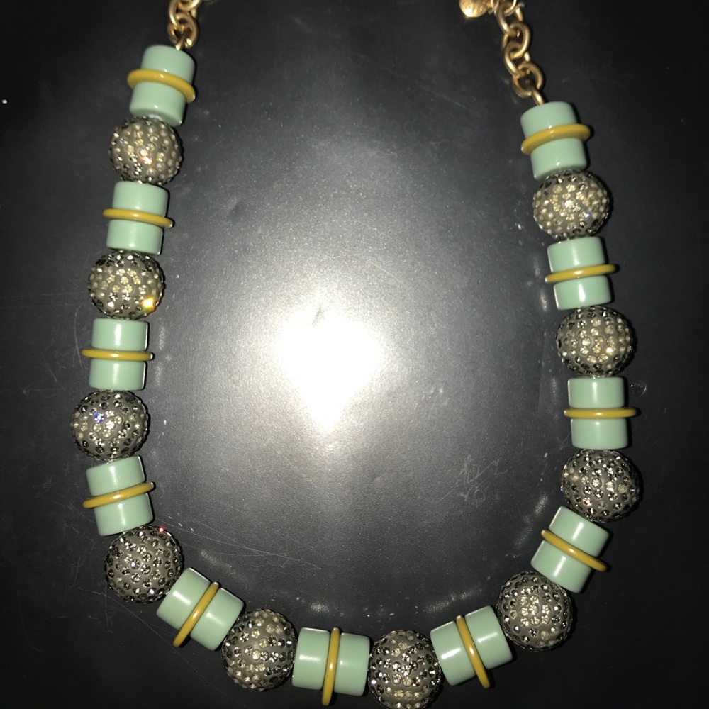 Green necklace with gold fastener