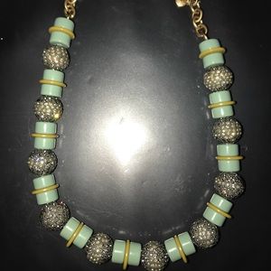 Green necklace with gold fastener