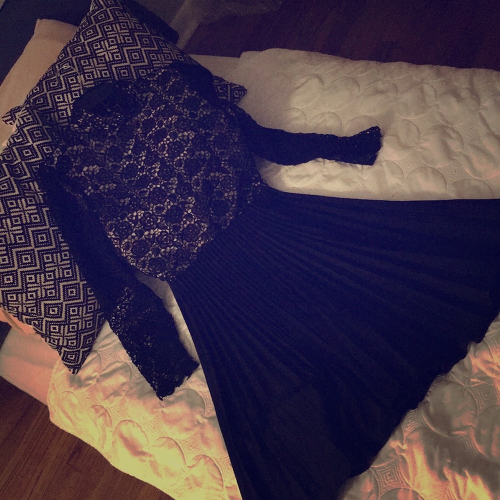 A crocheted/laced dress(top) with a black bottom