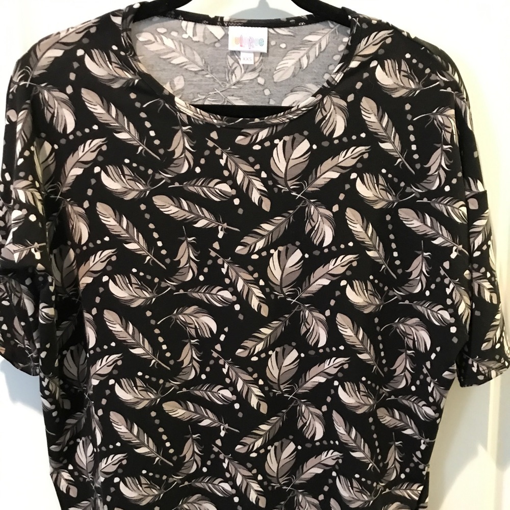 EUC. Lularoe Irma shirt black w/ feather pattern.