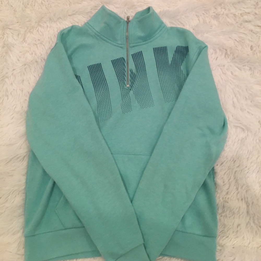 Pink half zip in a teal/ blue color