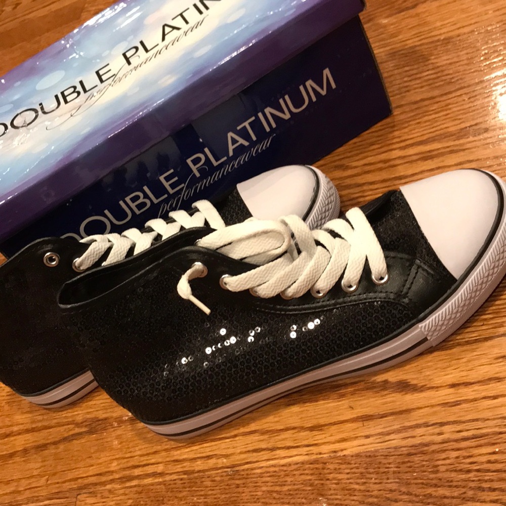 Black sequined high top sneakers.
