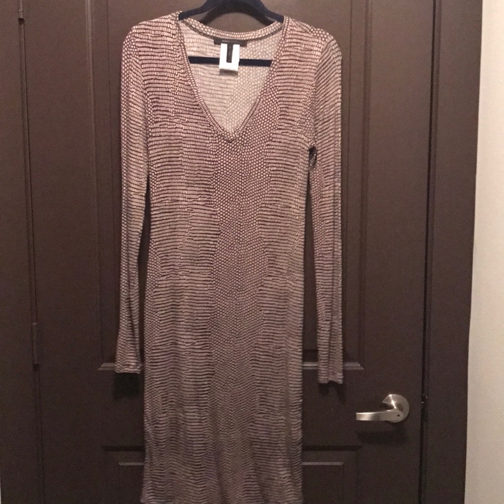 Form fitting mid length dress. Size runs big.