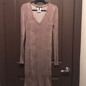 Form fitting mid length dress. Size runs big.