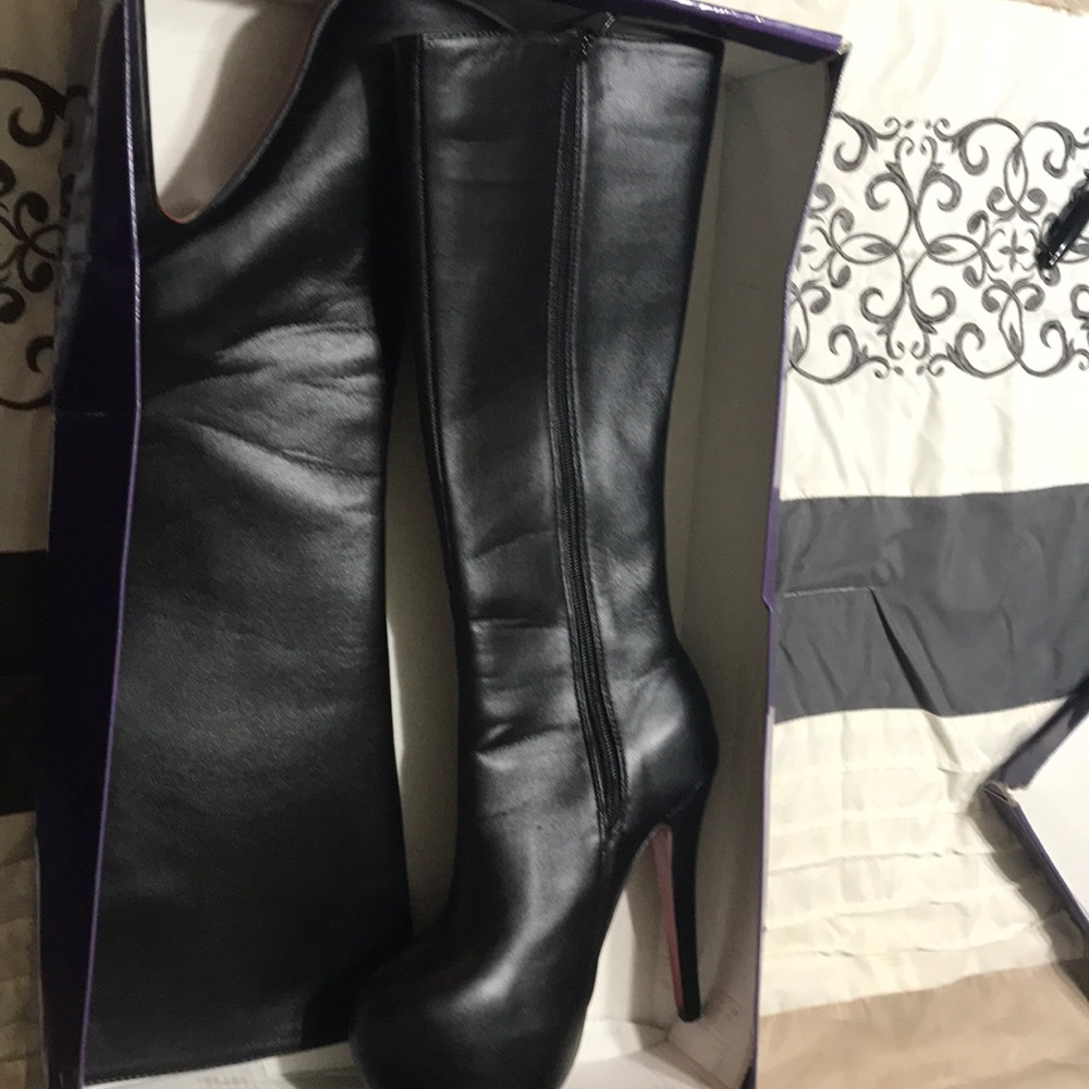 Black high heeled boots size 6.5