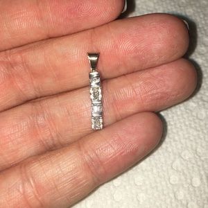 10k white gold round and baguette diamond pendant