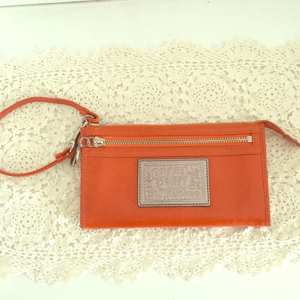 Orange Coach wristlet wallet