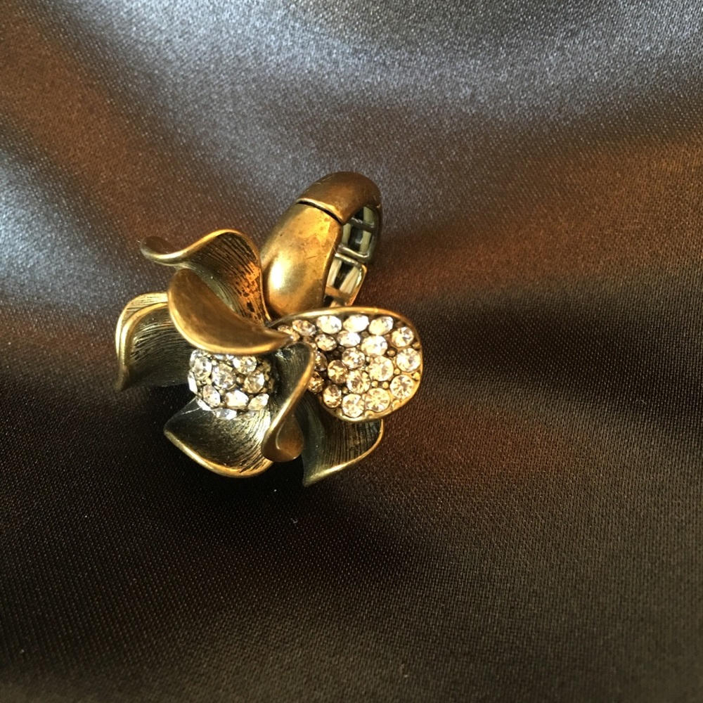 Gold colored flower and rhinestone cocktail ring