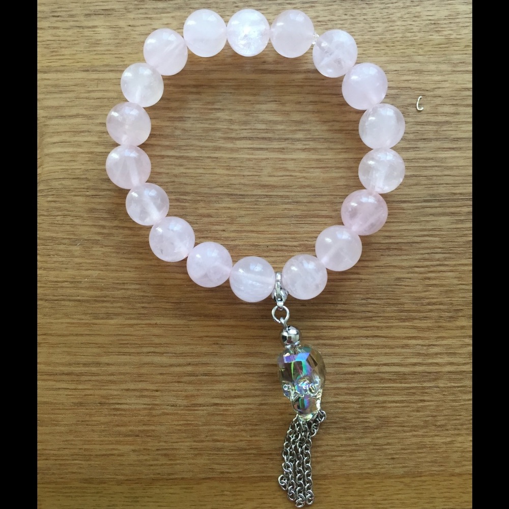 Rose quartz bracelet with Swarovski skull charm.