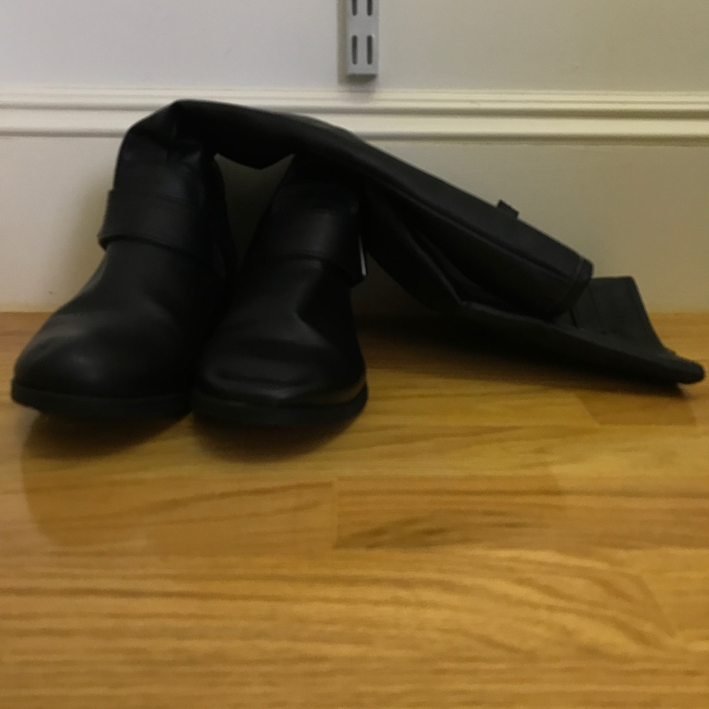 Tall black riding boots