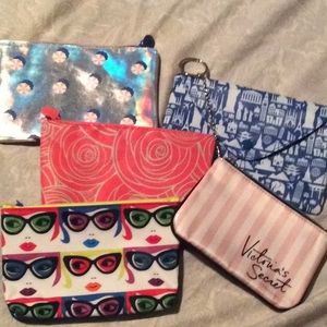 4 makeup bags from ipsy , and VS small  bag.