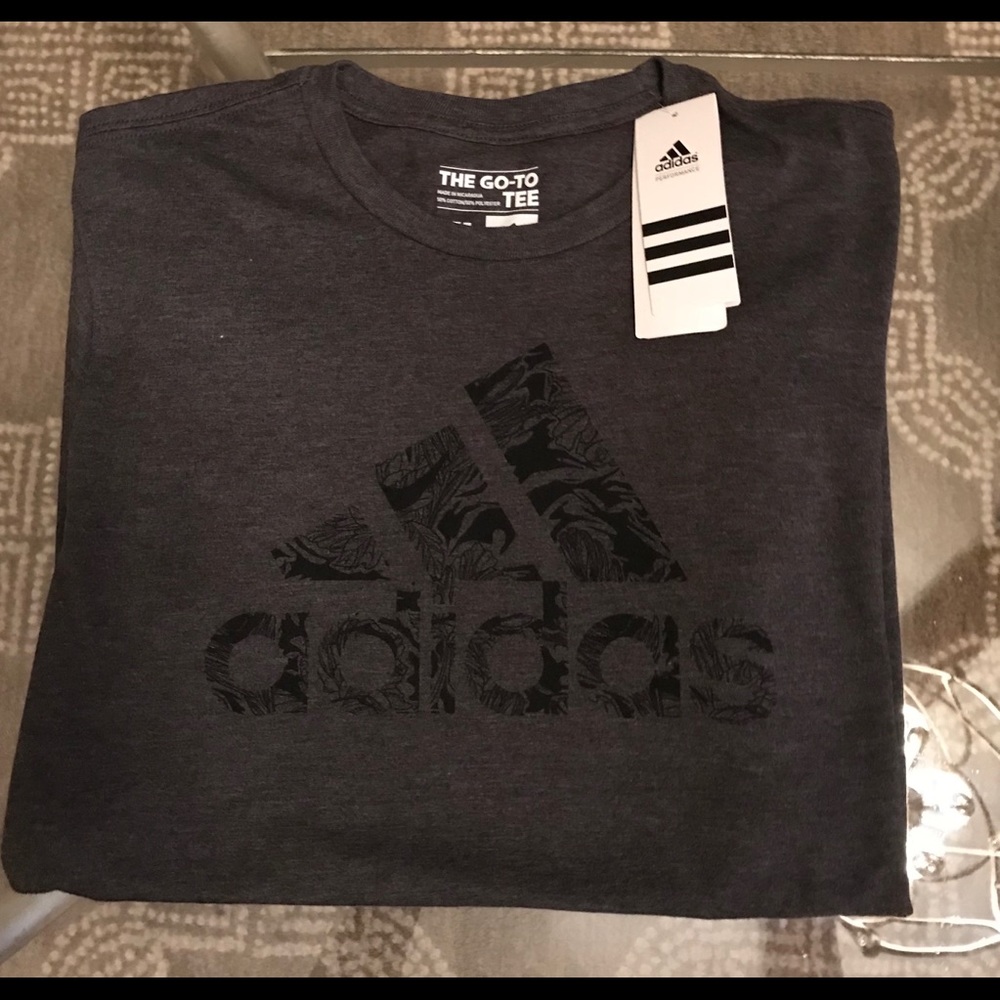 Women’s gray t-shirt with black flower like logo