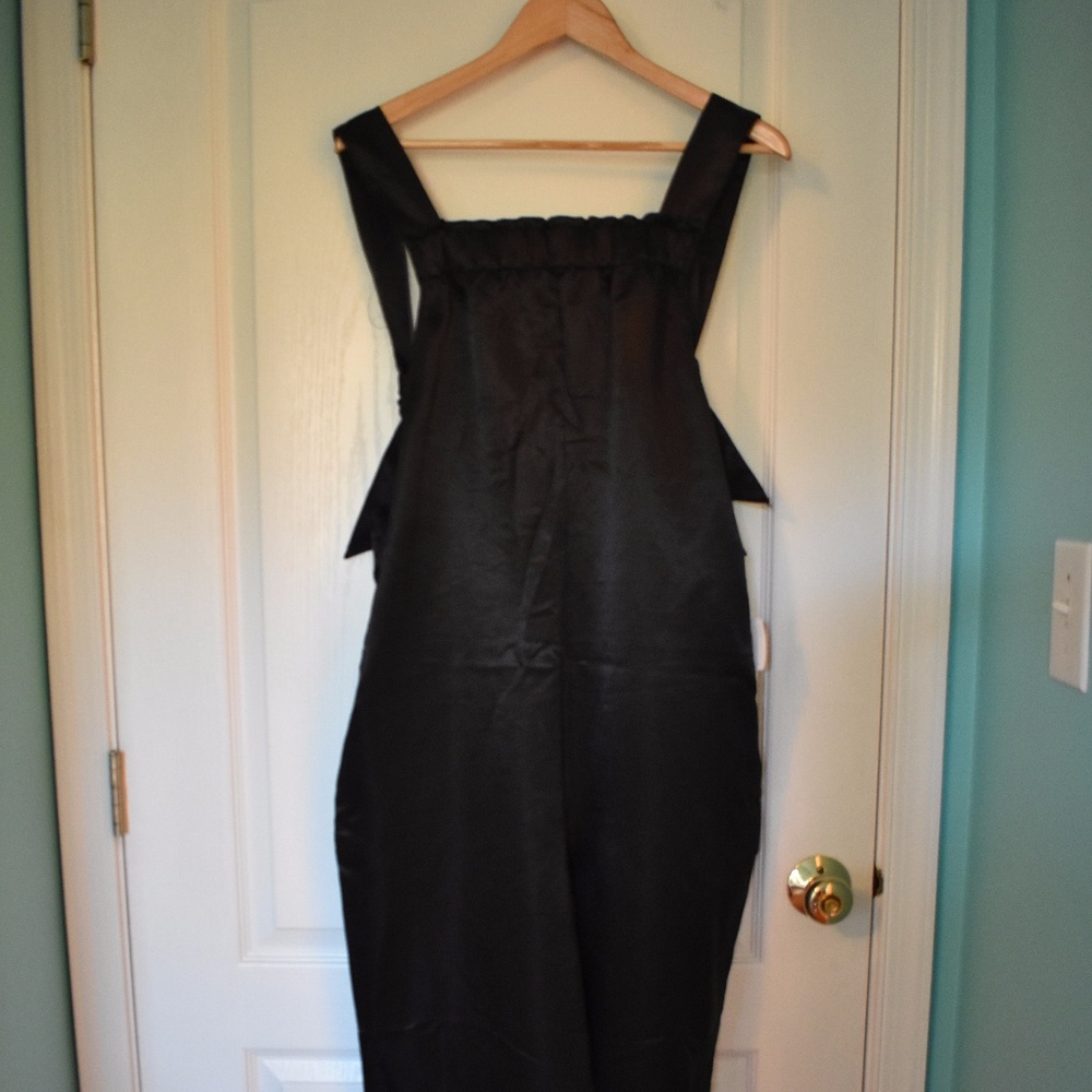 NWT Urban Outfitters black sateen jumpsuit size L