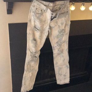 Bleach distressed denim jeans