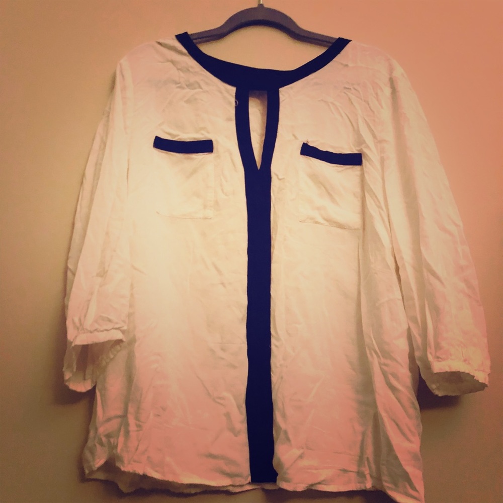 White long sleeved blouse with oval neck