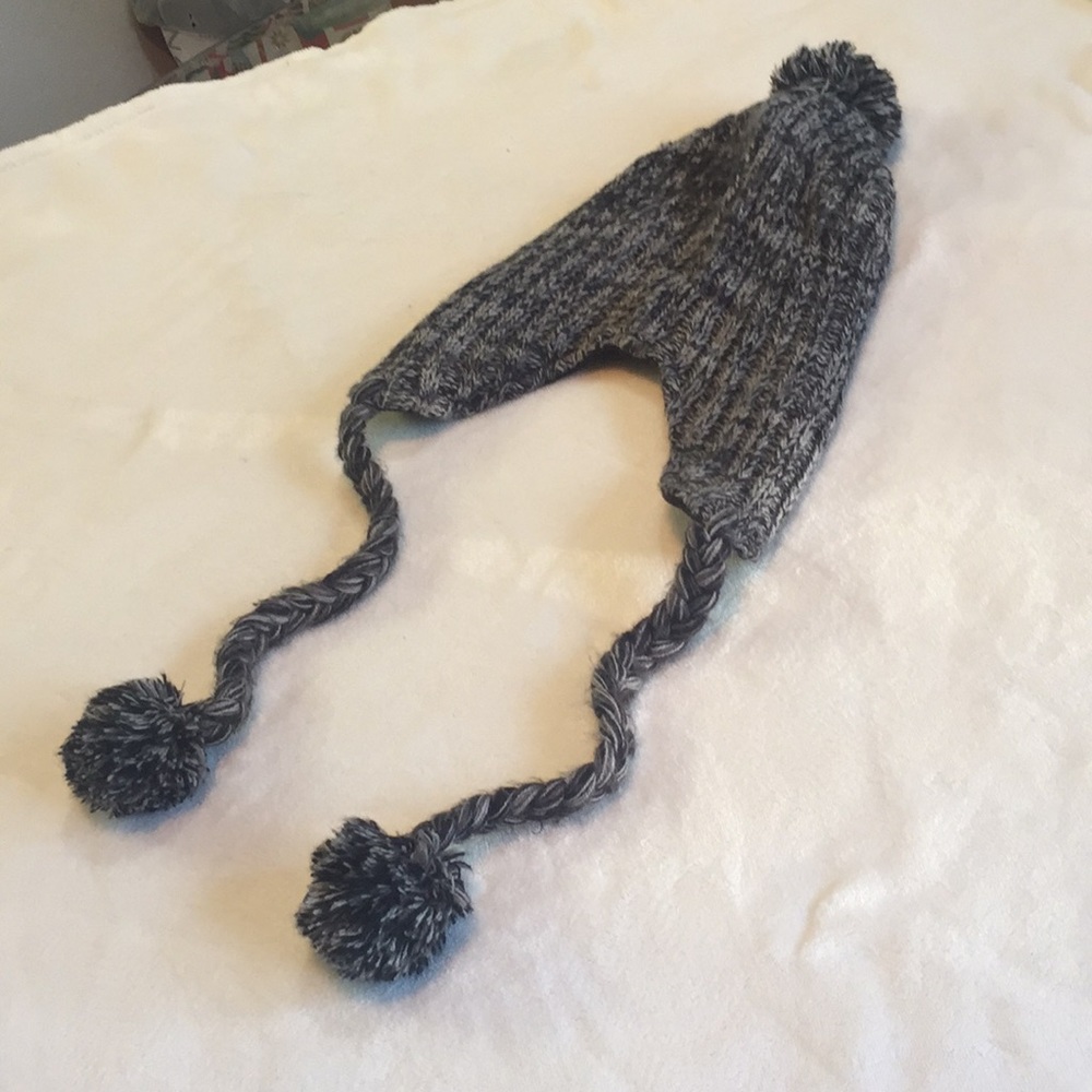 Used knitted fleece lined beanie with Poms