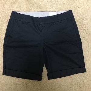 Black Bermuda shorts.