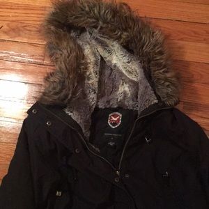 Black winter coat with fur hood. Long and warm