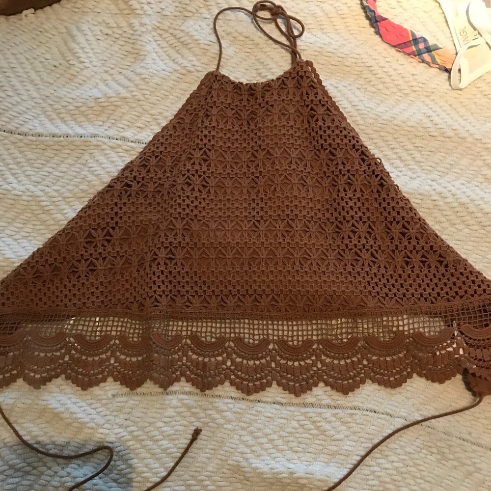 Crop top with straps around the back.