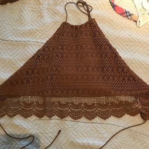 Crop top with straps around the back.