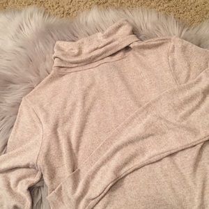 Light pink turtleneck with open back