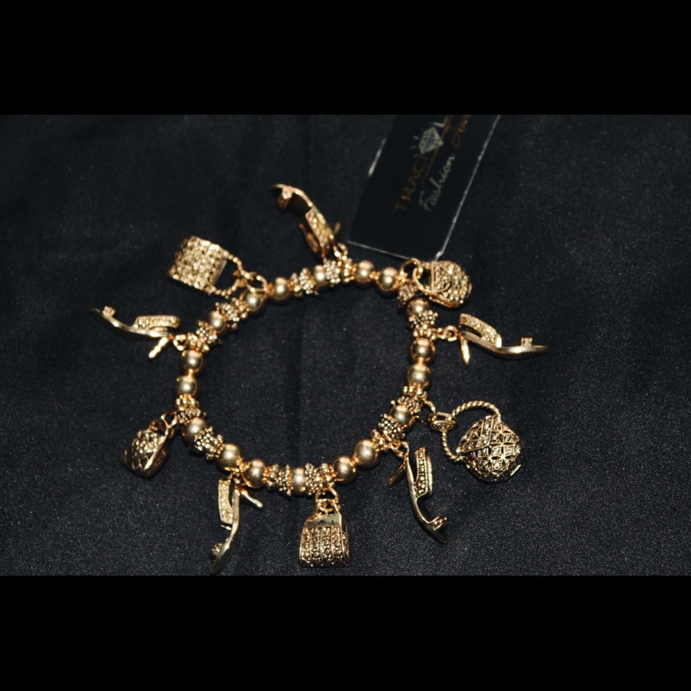 Traci Lynn Charm Bracelet 👛👑💓