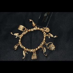 Traci Lynn Charm Bracelet 👛👑💓